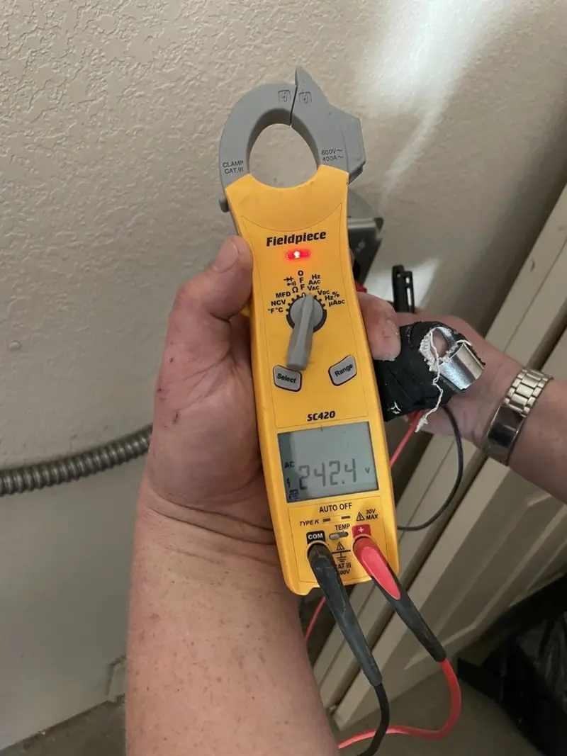 Voltage testing with clamp meter during Electrical Installation Services in Ohioville